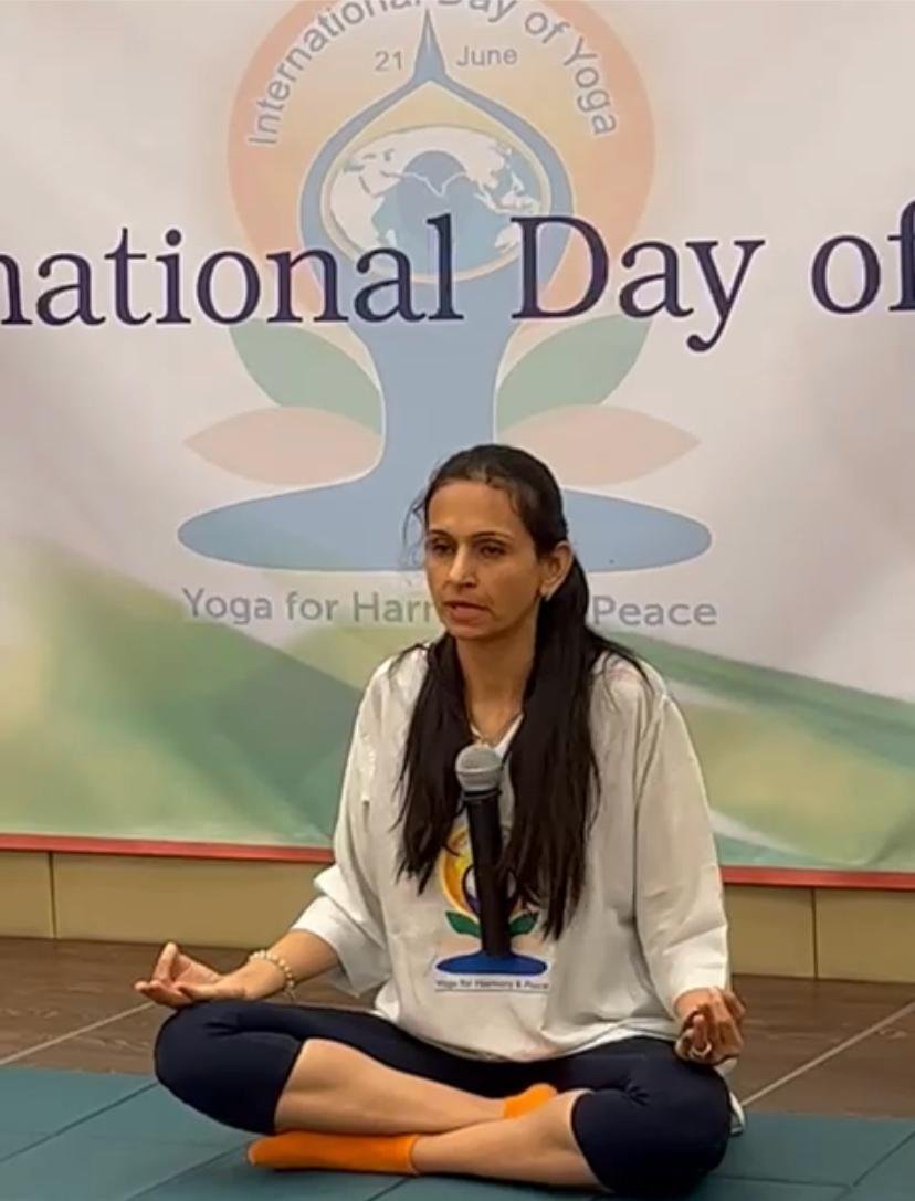 Neha Khera Saluja, yoga and mindfulness coach, in a calm professional setting