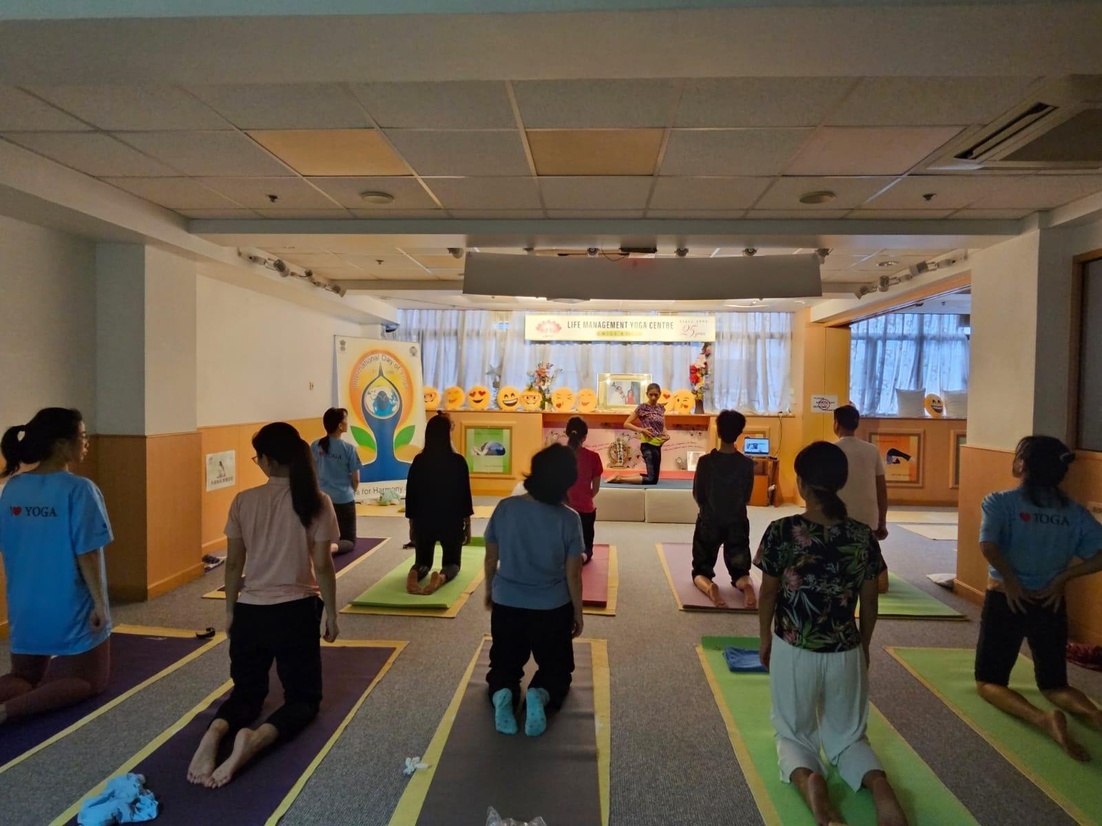 Neha Khera Saluja teaching a young learner during a hands-on yoga and mindfulness session