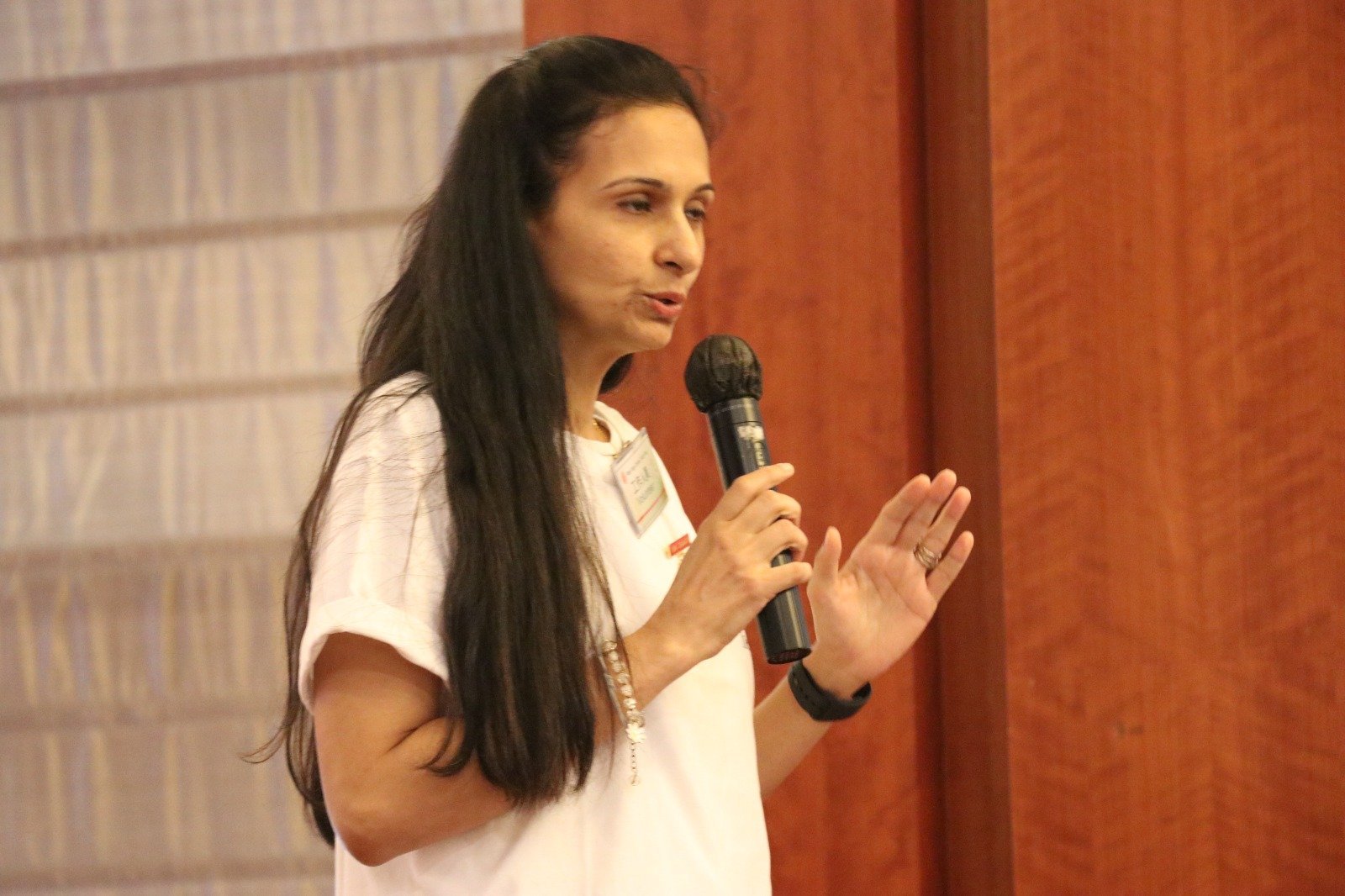 Neha Khera Saluja, yoga and mindfulness teacher, seated in a calm studio setting