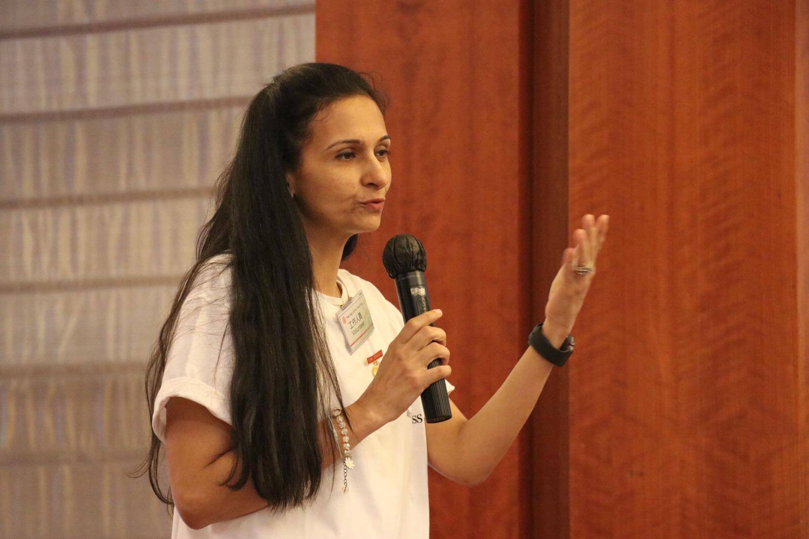 Neha Khera Saluja, yoga and mindfulness teacher, seated in a calm studio setting