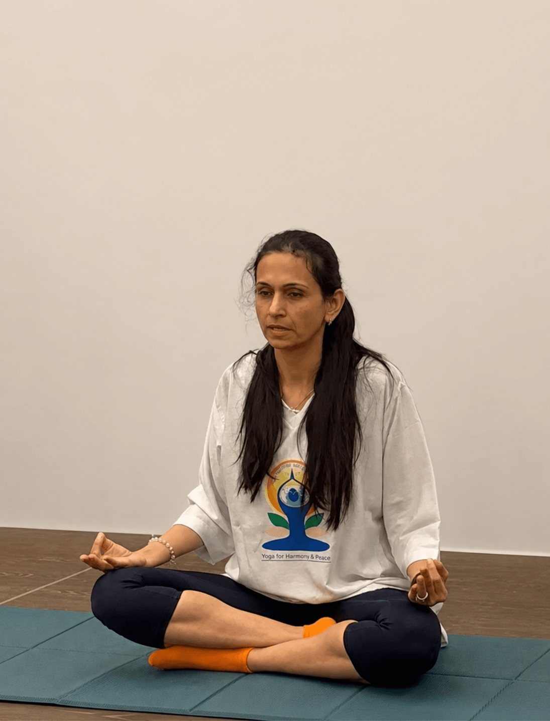 Neha Khera Saluja practising yoga in a bright, calm setting